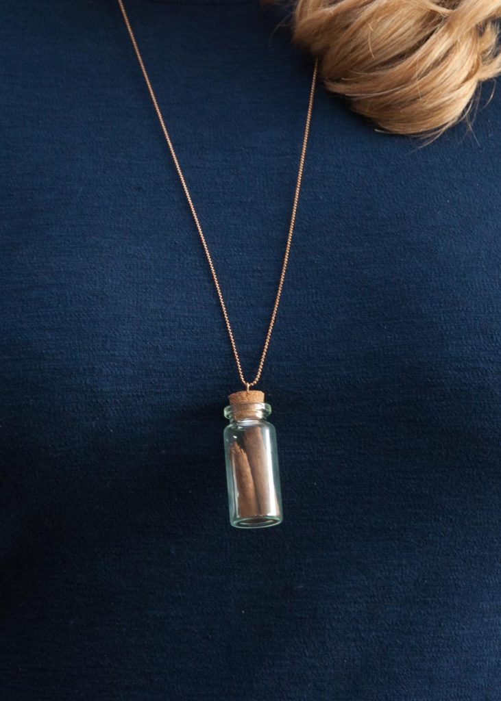 How to Make Apothecary Spice Jar Necklaces for Fall. A necklace with a small spice jar on it.