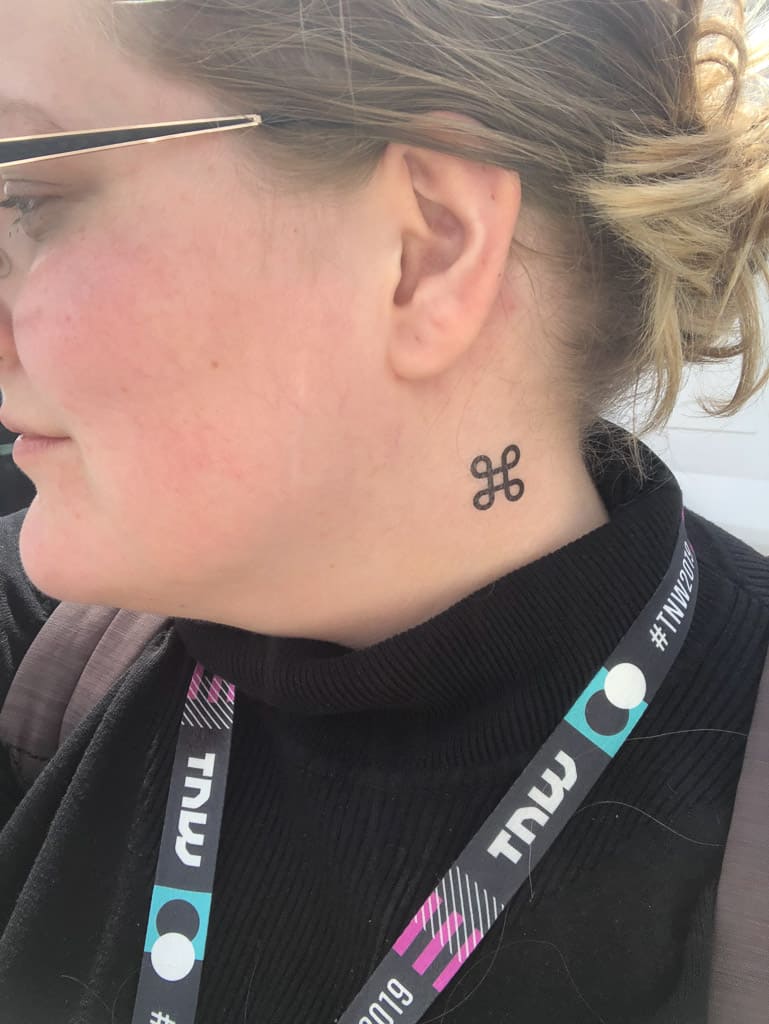 Me at one of the conferences I was invited to this year, with a fake neck tattoo of the Apple command symbol